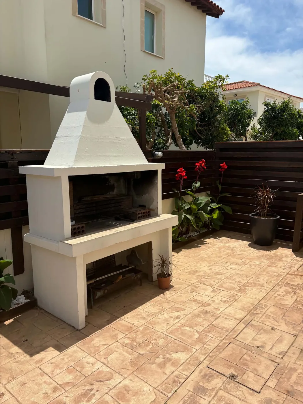 Palm Villa traditional stone BBQ and outdoor terrace dining area, Pernera Cyprus